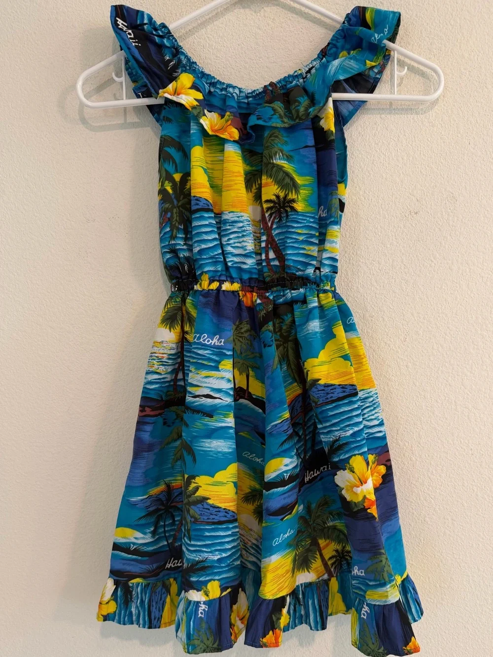 Girls Blue Tropical Ruffle Dress with Yellow Floral Accents